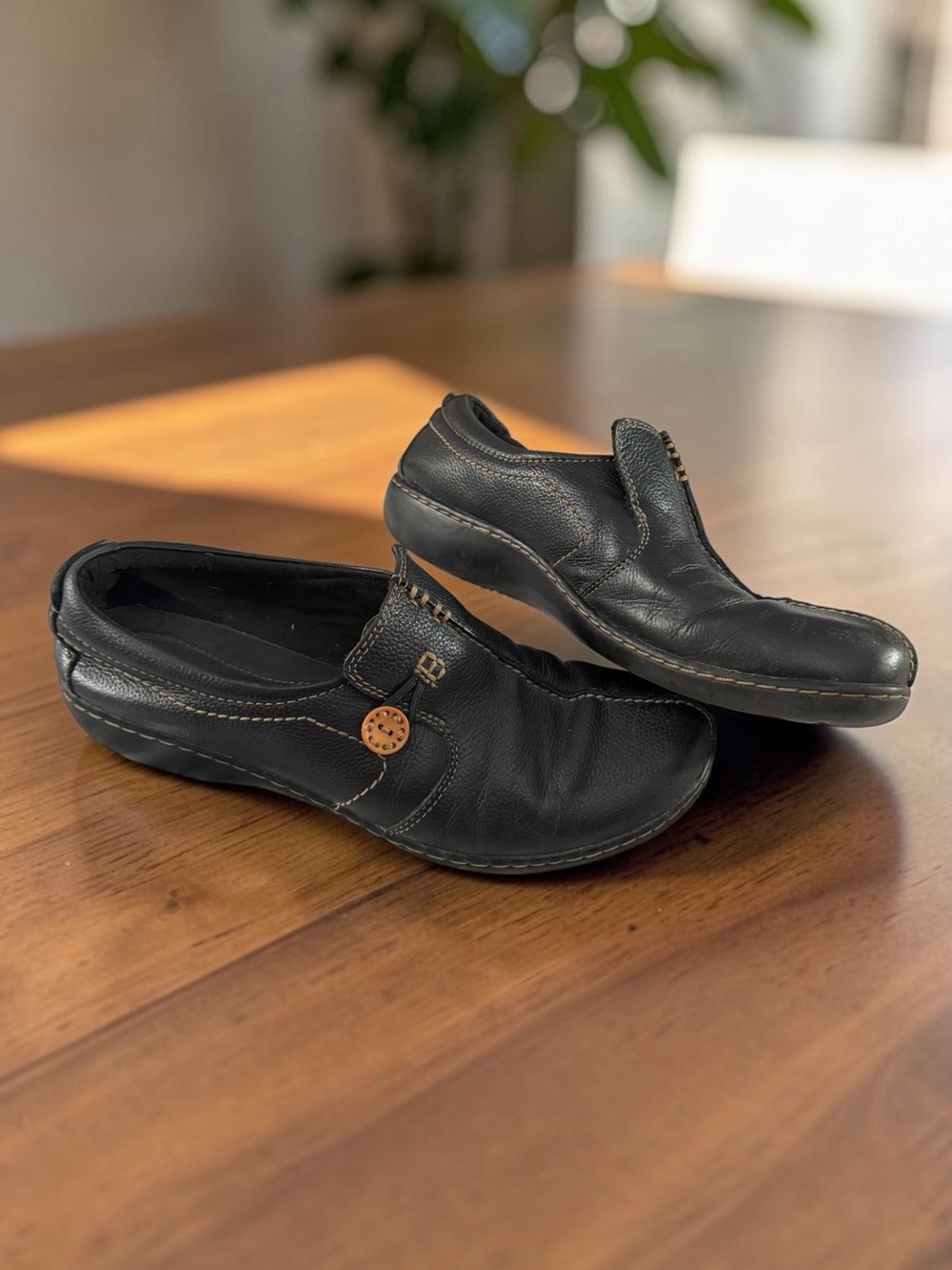Clarks Black Leather Slip-On Loafers with Brown Button Accent